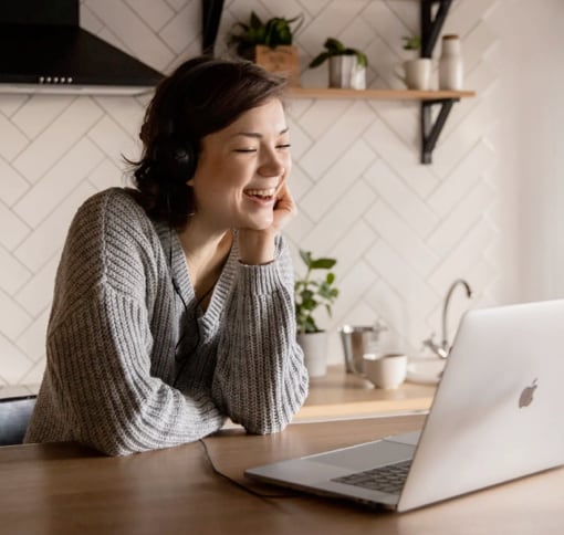 Young woman at her notebook in a video call